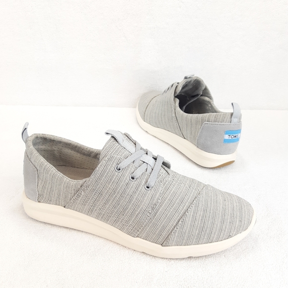 Toms Shoes - NWOT. TOMS LACE UP GRAY SNEAKERS